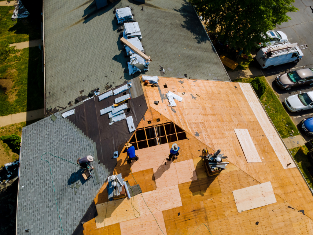Roofing crew repairing decking North Georgia